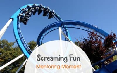 Looped roller coaster with riders upside down