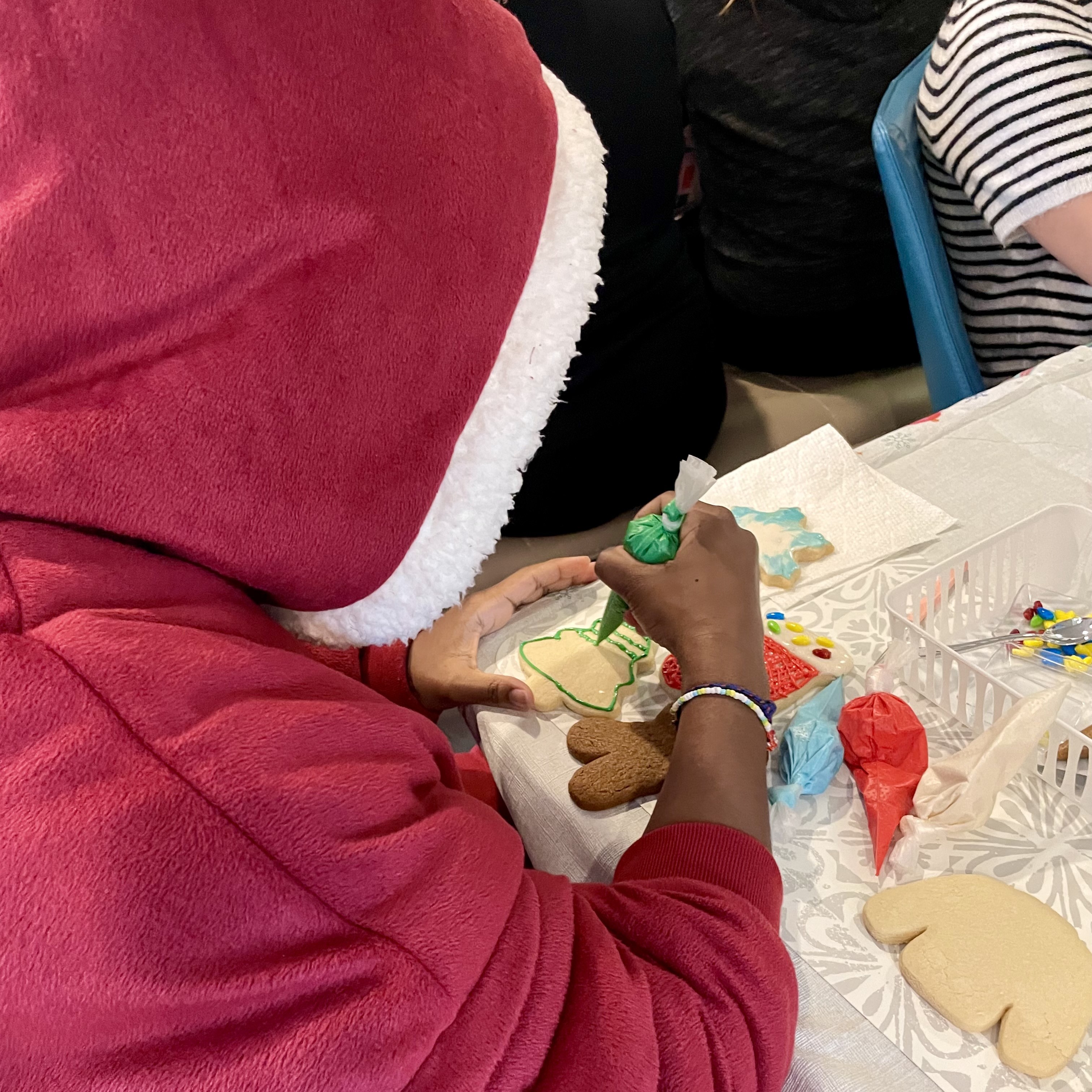 Mentee icing a cookie